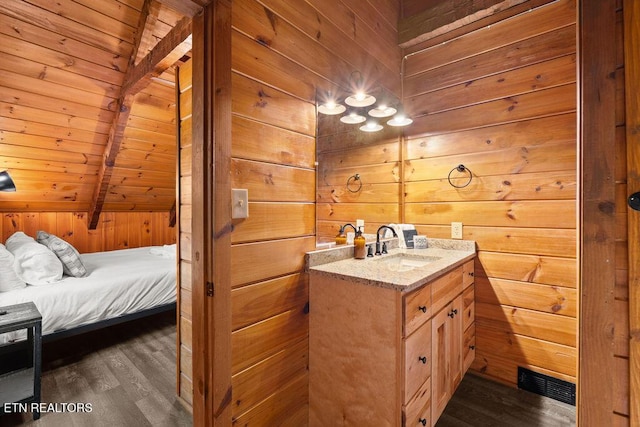 4372 Boogertown Rd Apt 3, Sevierville, TN 37876 - bathroom featuring vanity, wooden walls, wood finished floors, wood ceiling, and lofted ceiling