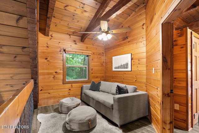 4372 Boogertown Rd Apt 3, Sevierville, TN 37876 - living area with wood walls, wooden ceiling with exposed beams, and a ceiling fan