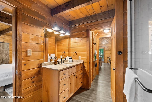 4372 Boogertown Rd Apt 3, Sevierville, TN 37876 - bathroom with wood walls, wood ceiling with exposed beams, wood finished floors, vanity, and ensuite bathroom