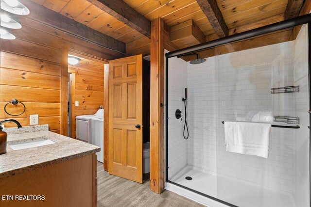4372 Boogertown Rd Apt 3, Sevierville, TN 37876 - bathroom featuring wooden ceiling with exposed beams, wood finished floors, a shower stall, vanity, and wood walls