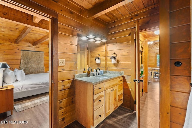 4372 Boogertown Rd Apt 2, Sevierville, TN 37876 - bathroom featuring wooden ceiling with exposed beams, wooden walls, wood finished floors, vanity, and ensuite bath
