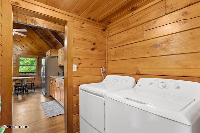 4372 Boogertown Rd Apt 2, Sevierville, TN 37876 - washroom featuring wooden ceiling, separate washer and dryer, wooden walls, light wood-style flooring, and a ceiling fan