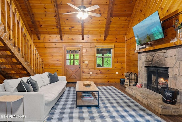 4372 Boogertown Rd Apt 2, Sevierville, TN 37876 - living room featuring wood finished floors, wooden ceiling, a fireplace, stairway, and wooden walls