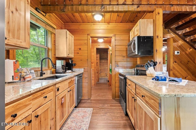 4372 Boogertown Rd Apt 2, Sevierville, TN 37876 - kitchen with stainless steel appliances, a sink, wood walls, light wood-style floors, and wood ceiling