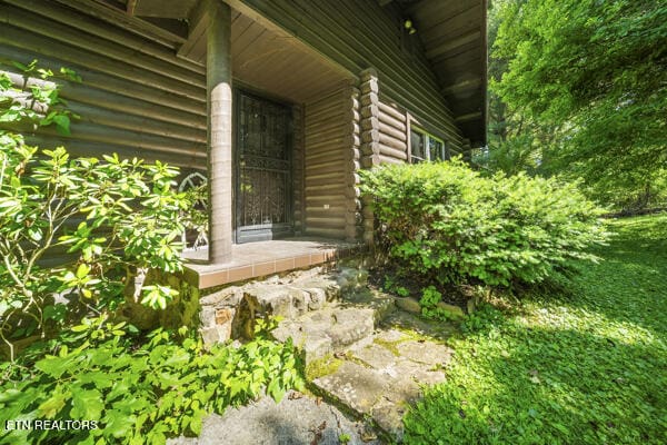 441 Morton Rd, Lafollette, TN 37766 - entrance to property with log siding and a porch