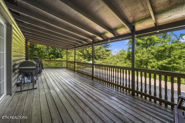 441 Morton Rd, Lafollette, TN 37766 - deck featuring view of scattered trees and area for grilling
