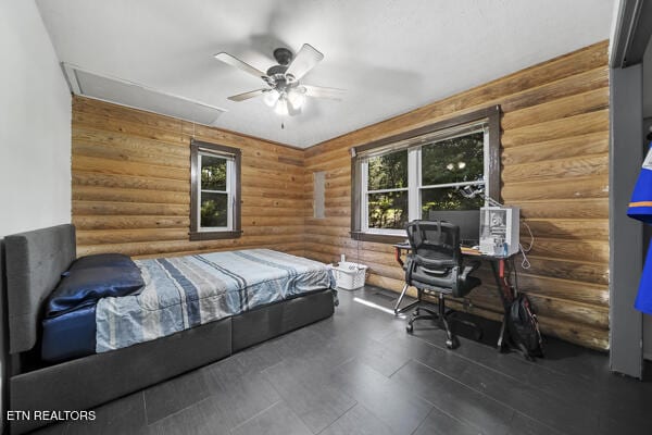 441 Morton Rd, Lafollette, TN 37766 - bedroom featuring log walls, multiple windows, attic access, ceiling fan, and a desk