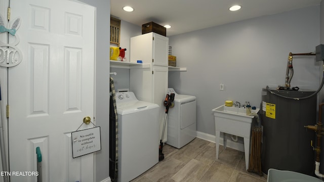 106 Alfred Mccammon Rd, Maryville, TN 37804 - washroom with water heater, washer and clothes dryer, recessed lighting, and baseboards