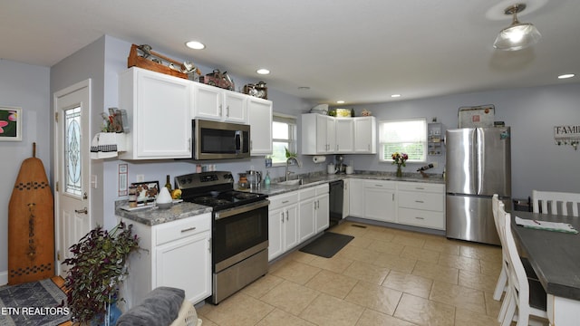 106 Alfred Mccammon Rd, Maryville, TN 37804 - kitchen featuring stainless steel appliances, white cabinetry, a sink, dark stone counters, and recessed lighting