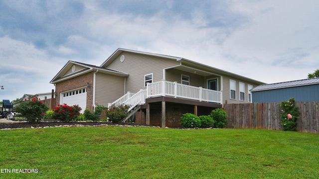 106 Alfred Mccammon Rd, Maryville, TN 37804 - rear view of property featuring a garage, brick siding, stairs, and a deck