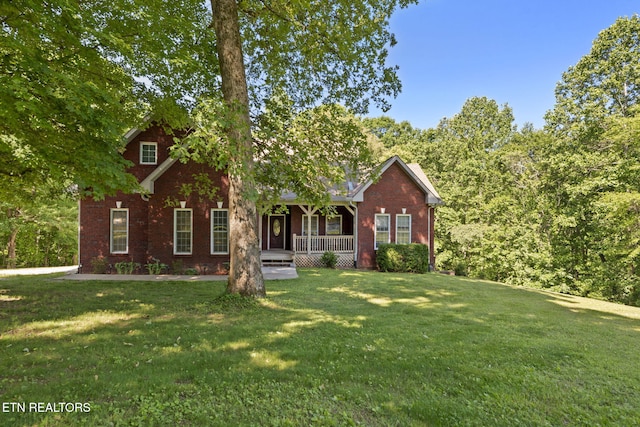 376 Old Holderford Rd, Kingston, TN 37763 - view of front of property with covered porch, brick siding, and a front lawn