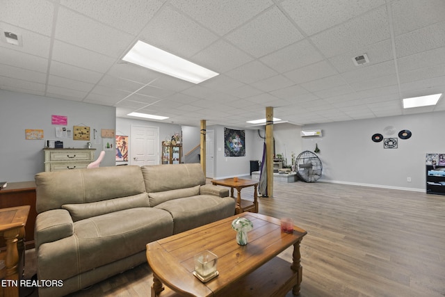 376 Old Holderford Rd, Kingston, TN 37763 - living area featuring wood finished floors, baseboards, and a drop ceiling