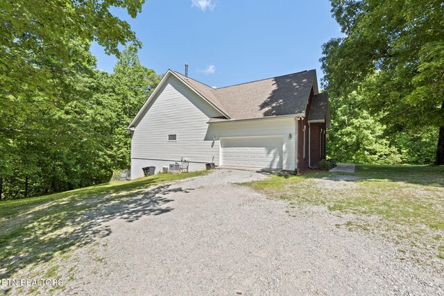 376 Old Holderford Rd, Kingston, TN 37763 - view of side of home featuring gravel driveway, a garage, and a shingled roof
