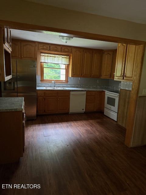 547 Knob Rd, Vonore, TN 37885 - kitchen with white appliances, a sink, dark wood finished floors, and light countertops
