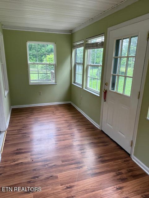 547 Knob Rd, Vonore, TN 37885 - doorway featuring wood finished floors, baseboards, and crown molding