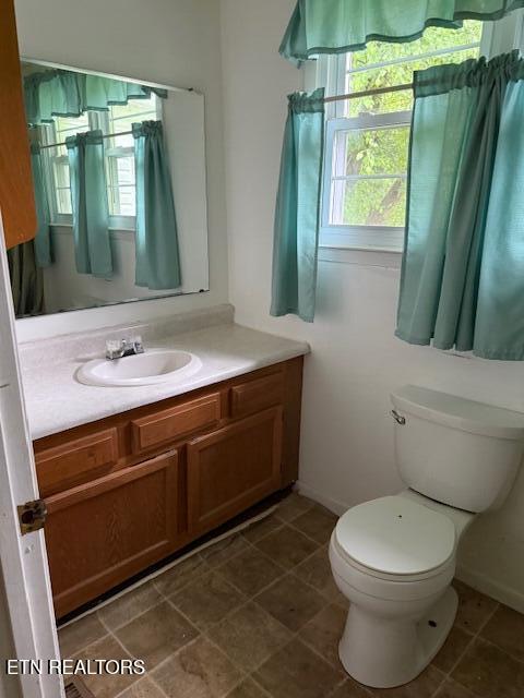 547 Knob Rd, Vonore, TN 37885 - bathroom with vanity, toilet, and plenty of natural light