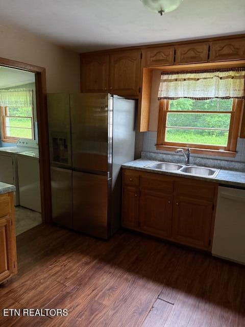 547 Knob Rd, Vonore, TN 37885 - kitchen featuring a sink, white dishwasher, independent washer and dryer, stainless steel refrigerator with ice dispenser, and dark wood-style flooring
