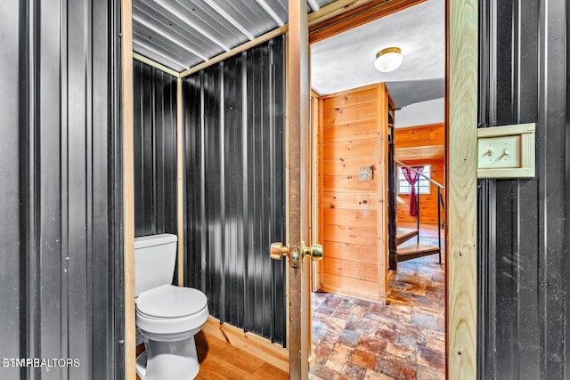 1513 Tyler Way, Sevierville, TN 37876 - bathroom with toilet, wooden walls, and stone finish flooring