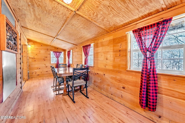 1513 Tyler Way, Sevierville, TN 37876 - dining space featuring vaulted ceiling, wooden ceiling, wood walls, plenty of natural light, and hardwood / wood-style floors