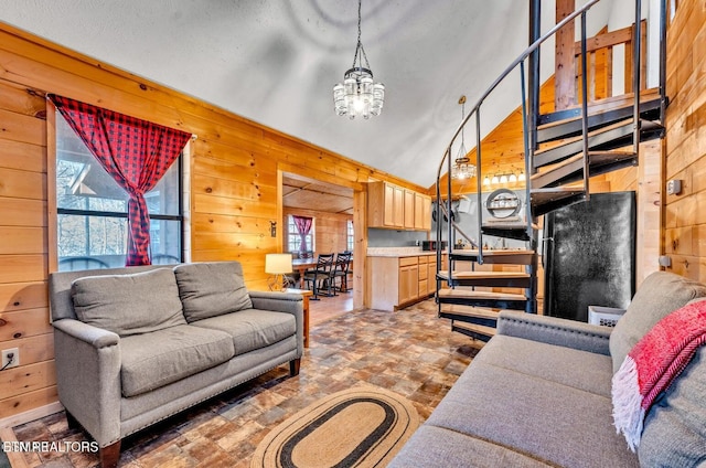 1513 Tyler Way, Sevierville, TN 37876 - living area featuring wood walls, plenty of natural light, lofted ceiling, and a chandelier