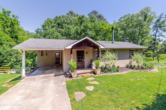 1932 Duncan Rd, Knoxville, TN 37919 - ranch-style house featuring brick siding, an attached carport, concrete driveway, and roof with shingles