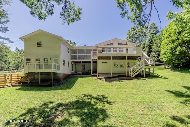 1932 Duncan Rd, Knoxville, TN 37919 - back of house with stairway, a wooden deck, and a sunroom