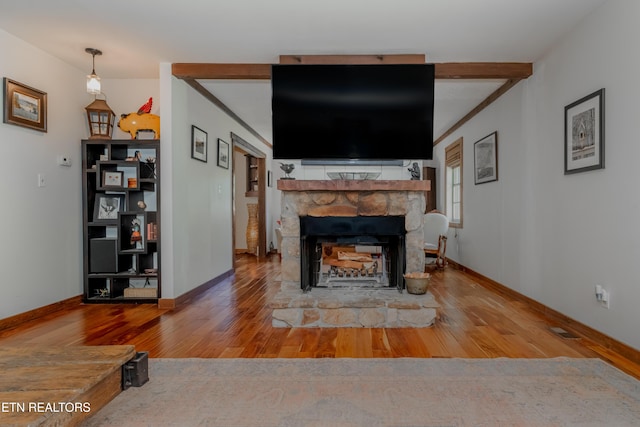1932 Duncan Rd, Knoxville, TN 37919 - living room with wood finished floors, a fireplace, and baseboards