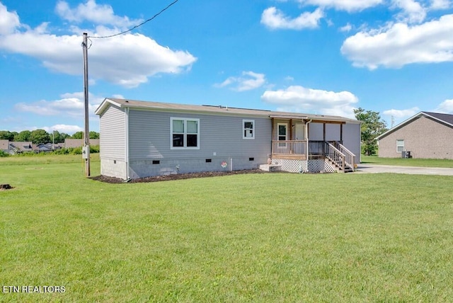 3841 Mcbroom Chapel Rd, Cookeville, TN 38501 - back of house with crawl space, a porch, and a lawn