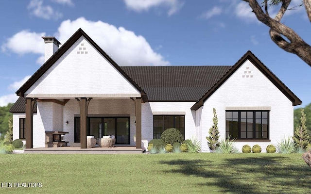 LOT15 Golanvyi Trl, Vonore, TN 37885 - back of house with a chimney, a yard, and brick siding