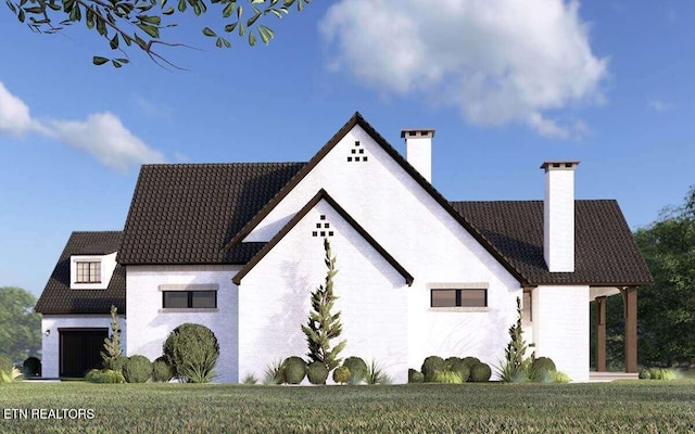 LOT15 Golanvyi Trl, Vonore, TN 37885 - view of home's exterior featuring a chimney, brick siding, and a garage