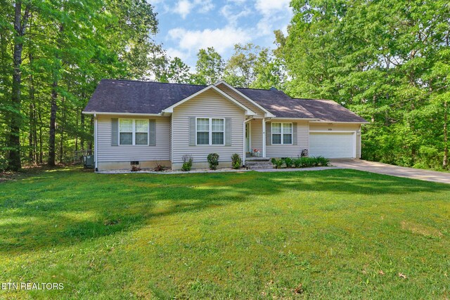 3021 Shawnee Rd, Crossville, TN 38572 - ranch-style house featuring a garage, concrete driveway, a front yard, and central AC