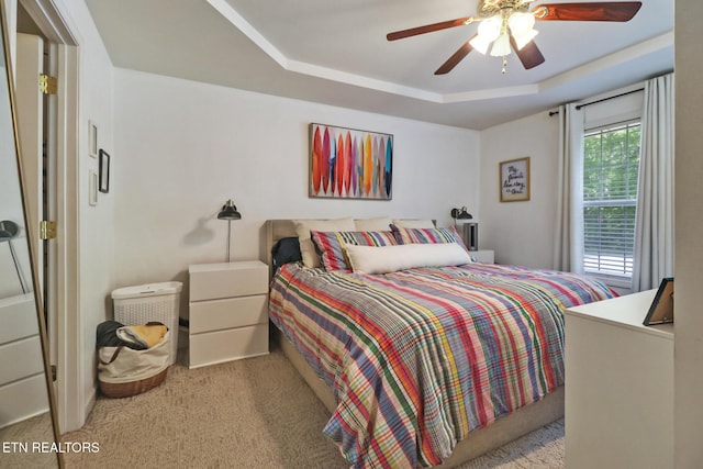 3021 Shawnee Rd, Crossville, TN 38572 - carpeted bedroom featuring a raised ceiling and a ceiling fan