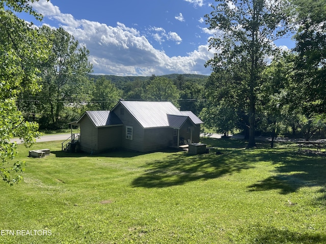 2045 Winona Rd, Huntsville, TN 37756 - view of green lawn featuring a wooded view