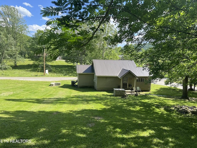 2045 Winona Rd, Huntsville, TN 37756 - view of side of home with a yard and metal roof
