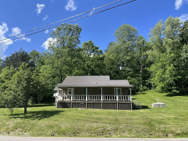 2045 Winona Rd, Huntsville, TN 37756 - view of front facade featuring covered porch, a front lawn, and metal roof