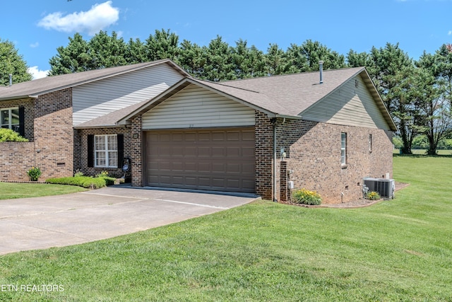 327 Villa Dr Unit 327, Seymour, TN 37865 - view of front of property with central AC, brick siding, an attached garage, driveway, and a front lawn