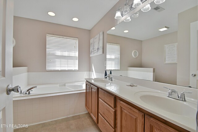 5821 Matalin Ln, Knoxville, TN 37918 - full bathroom with healthy amount of natural light, a bath, double vanity, tile patterned floors, and recessed lighting