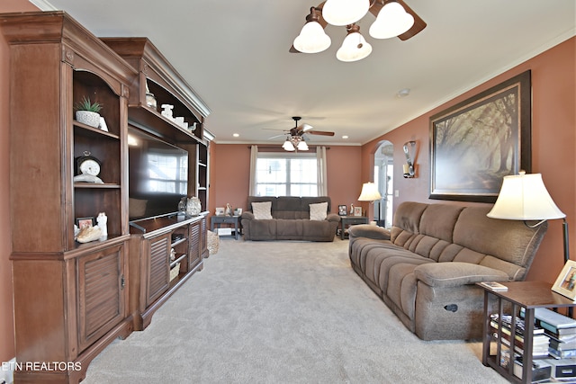 5821 Matalin Ln, Knoxville, TN 37918 - living room featuring carpet floors, ornamental molding, ceiling fan, a chandelier, and arched walkways