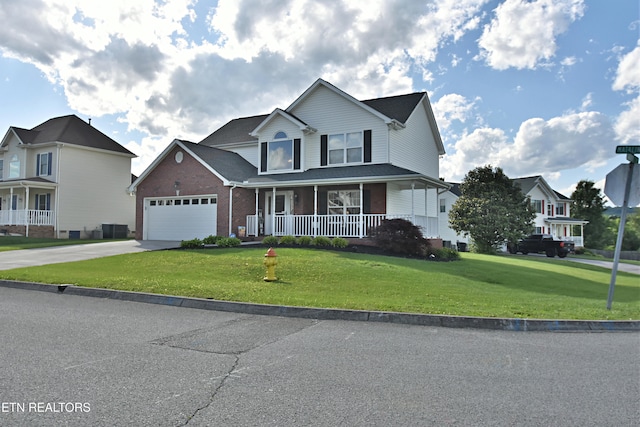 5821 Matalin Ln, Knoxville, TN 37918 - view of front of house featuring a porch, brick siding, a front yard, driveway, and a garage