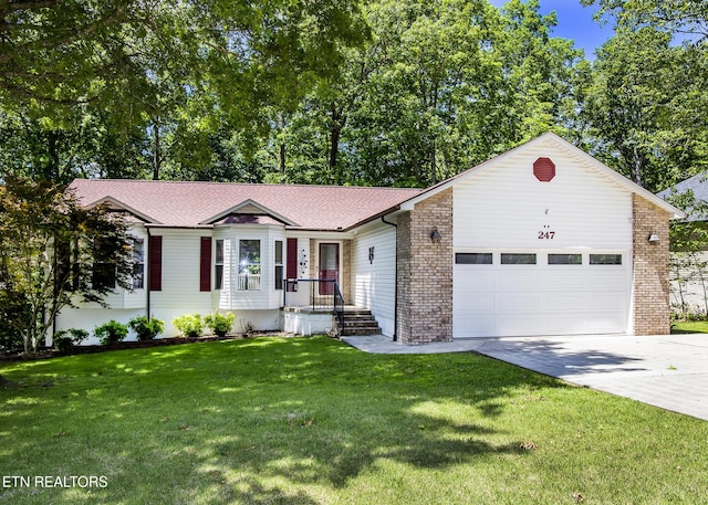 247 Lakeview Dr, Crossville, TN 38558 - ranch-style home with an attached garage, driveway, a front yard, and brick siding