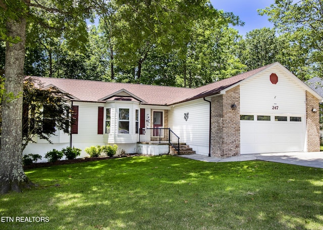 247 Lakeview Dr, Crossville, TN 38558 - ranch-style house featuring a garage, concrete driveway, and a front lawn