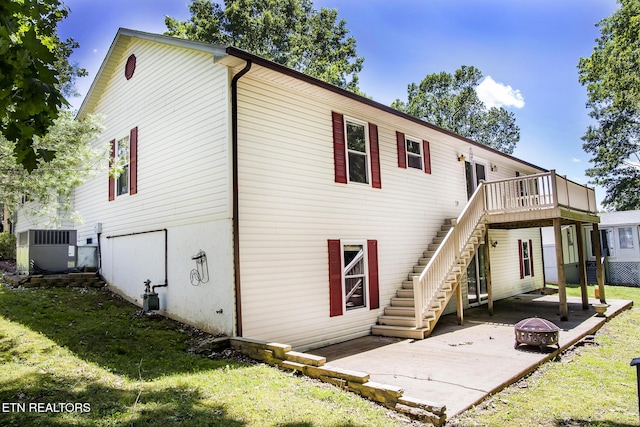 247 Lakeview Dr, Crossville, TN 38558 - back of house featuring cooling unit, an outdoor fire pit, stairway, a yard, and a patio area