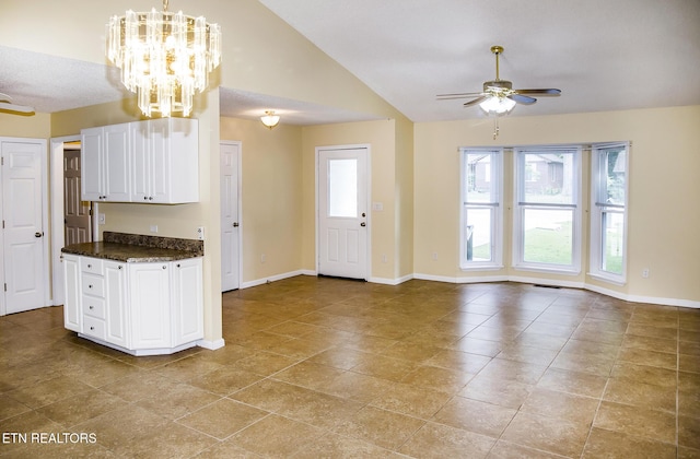 247 Lakeview Dr, Crossville, TN 38558 - kitchen featuring ceiling fan, vaulted ceiling, white cabinets, a chandelier, and baseboards