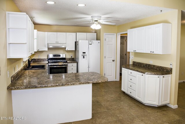 247 Lakeview Dr, Crossville, TN 38558 - kitchen with stainless steel gas range oven, white refrigerator with ice dispenser, a sink, under cabinet range hood, and ceiling fan
