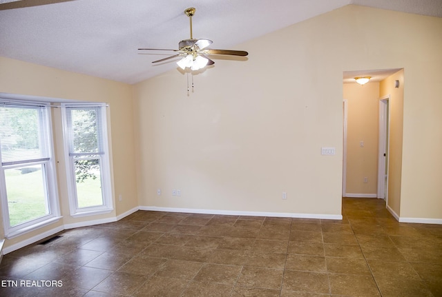 247 Lakeview Dr, Crossville, TN 38558 - unfurnished room with vaulted ceiling, a ceiling fan, baseboards, and tile patterned flooring