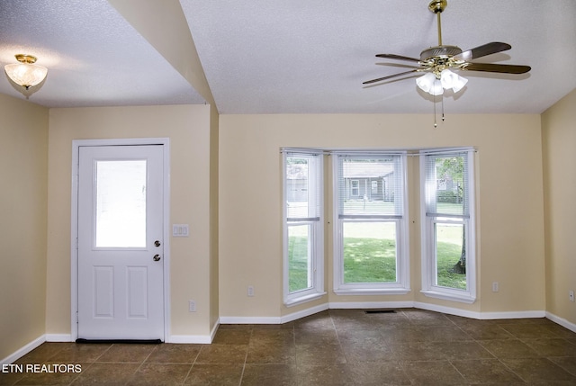 247 Lakeview Dr, Crossville, TN 38558 - entryway with baseboards, a ceiling fan, dark tile patterned floors, and a textured ceiling