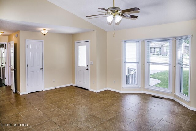 247 Lakeview Dr, Crossville, TN 38558 - entryway featuring plenty of natural light, lofted ceiling, ceiling fan, baseboards, and dark tile patterned floors