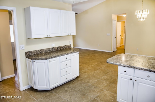 247 Lakeview Dr, Crossville, TN 38558 - kitchen featuring white cabinetry, baseboards, a chandelier, dark countertops, and pendant lighting