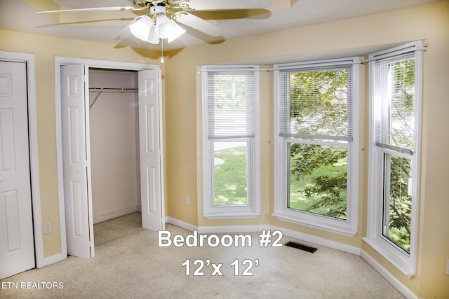 247 Lakeview Dr, Crossville, TN 38558 - unfurnished bedroom with carpet floors, baseboards, multiple closets, and ceiling fan