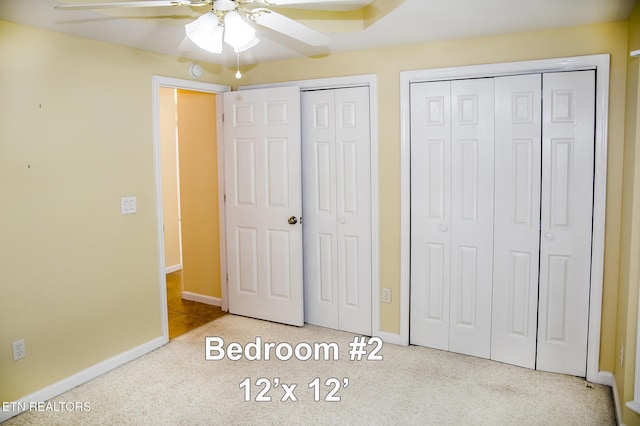 247 Lakeview Dr, Crossville, TN 38558 - unfurnished bedroom with two closets, baseboards, and ceiling fan